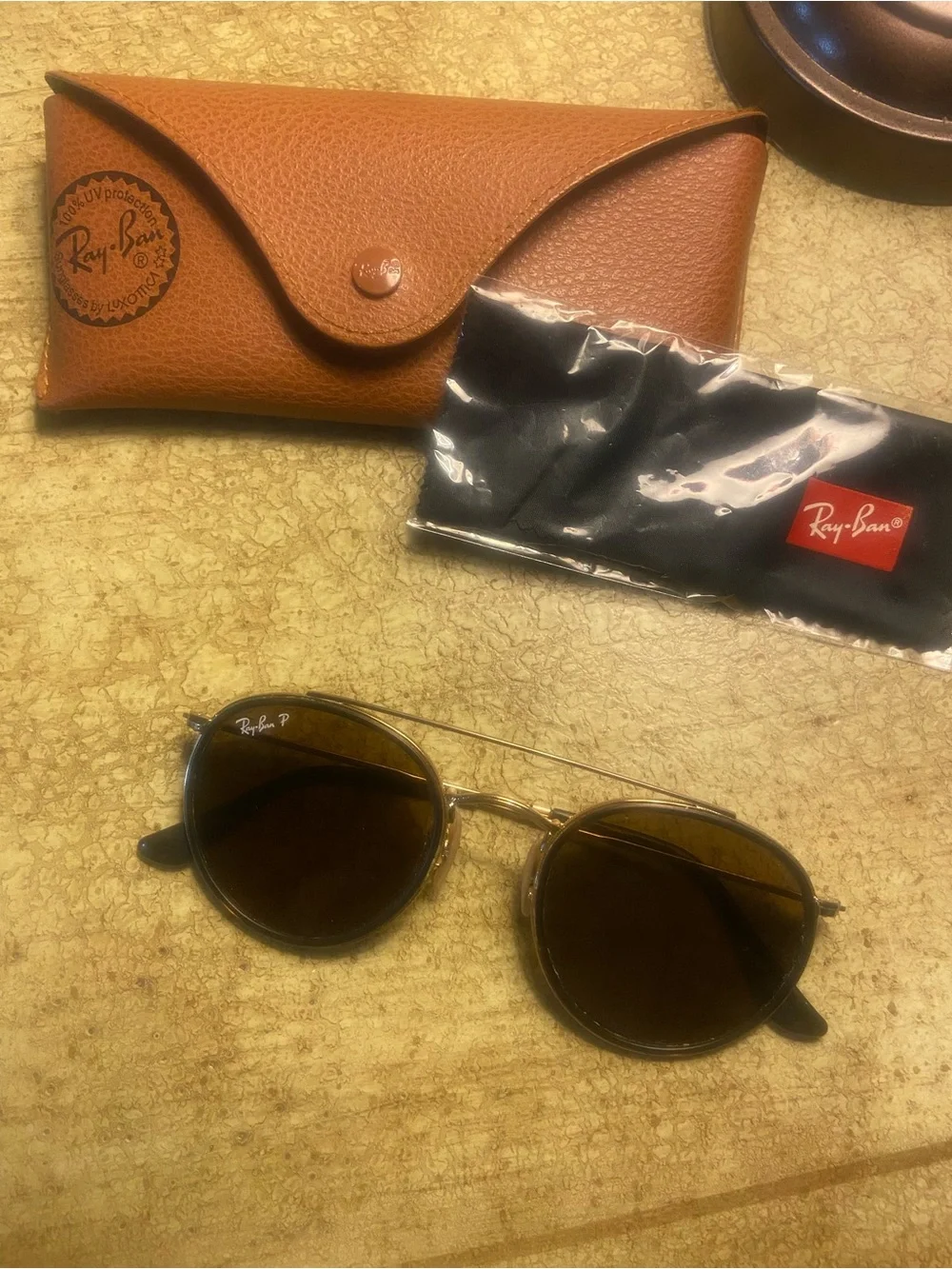 Ray-Ban Round, Polarized Sunglasses in Brown Lenses and Gold Frames